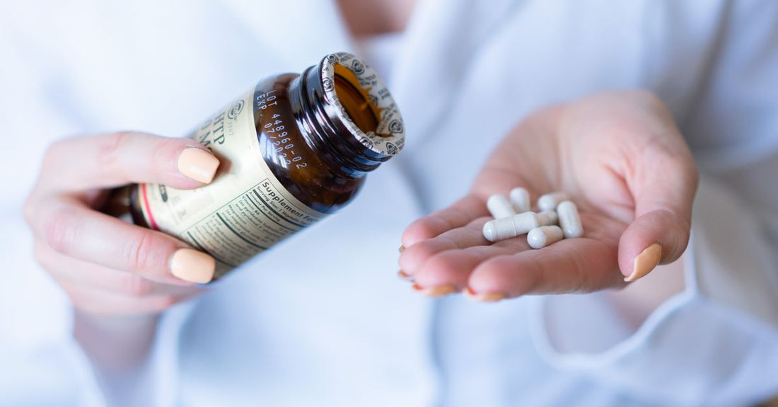 A bottle of nattokinase supplement capsules on a clean white surface, representing what is nattokinase supplement used for in circulatory health.