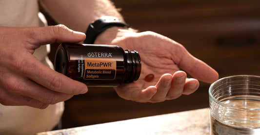 Carlyle Vitamin ADK supplement benefits shown with a bottle of softgels and a glass of water.