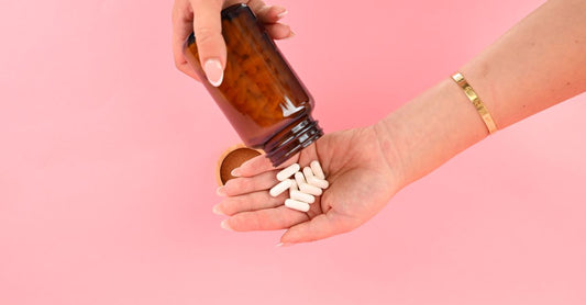 Two vitamin B12 supplement bottles side by side, one labelled methylcobalamin and the other cyanocobalamin, illustrating the vitamin b12 methylcobalamin vs cyanocobalamin choice.