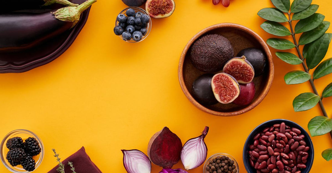 A flatlay of anti-inflammatory foods and supplements for an endometriosis diet and nutrition guide.