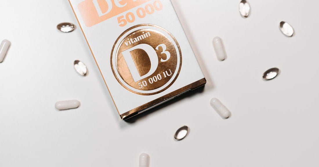 Bottles of vitamin D3 and K2 capsules on a clean white surface, illustrating the popular combined supplement for bone and heart health.