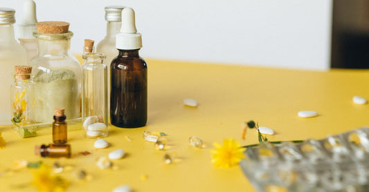Colourful vitamin bottles and capsules on a white background, illustrating the ultimate vitamin myths busted for UK shoppers in 2026.