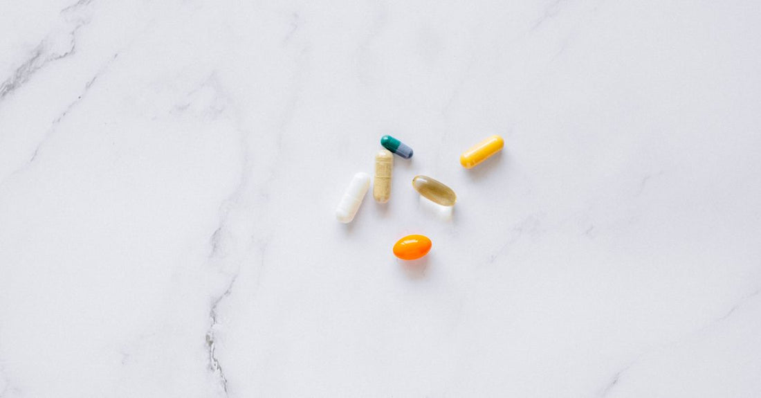 Thyroid support supplement capsules on a clean white surface, illustrating ingredients explained in the article.