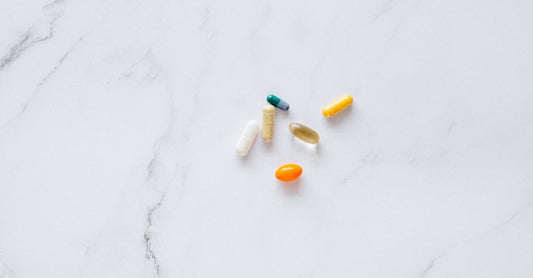 Thyroid support supplement capsules on a clean white surface, illustrating ingredients explained in the article.
