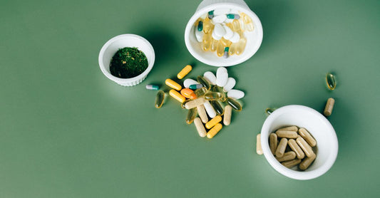 A bottle of multivitamin tablets for men over 50 on a clean white surface, illustrating how to choose the right supplement.
