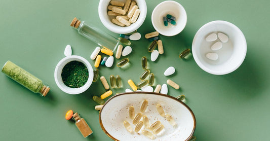 A glass bottle of silica supplement capsules on a clean white shelf, representing silica supplement for hair skin nails benefits in the UK.