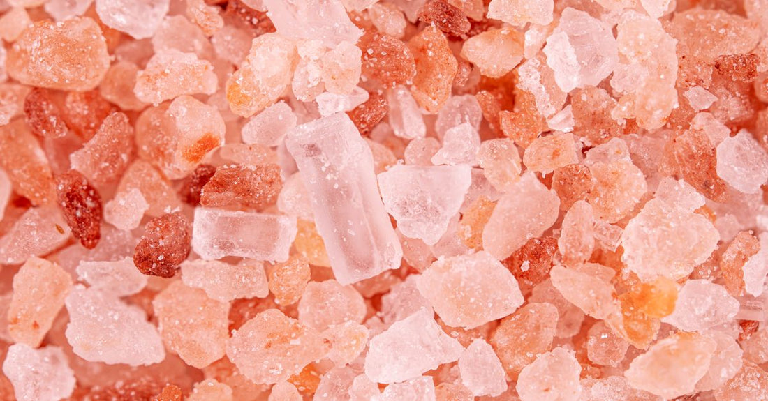 Jar of Himalayan salt capsules on a clean white background, showcasing bucked up himalayan salt capsules benefits for hydration and electrolyte balance.