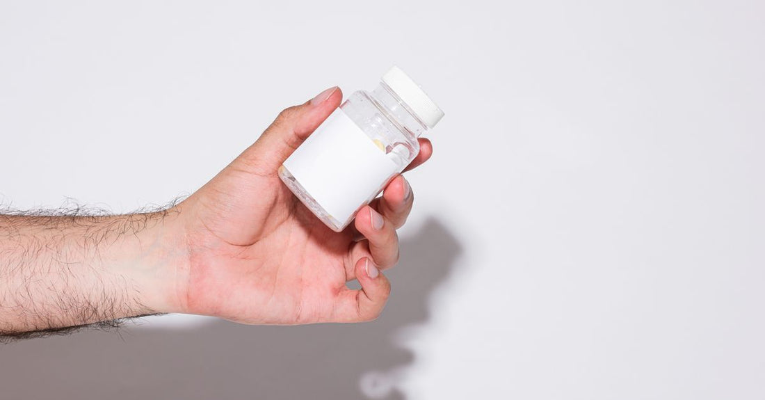 A silica supplement bottle placed on a clean surface, representing why silica is important for collagen production.